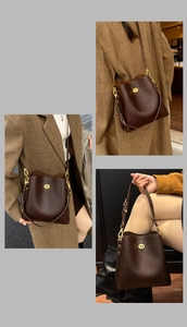 Detail of dark brown lychee pattern bucket bag with golden oval twist lock closure