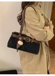 Retro baguette bag in black suede with brown leather trim and ice cream charm on model