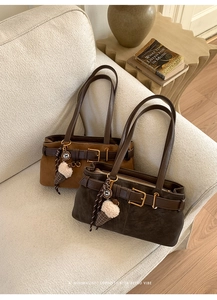 Retro baguette shoulder bags in brown suede finish with minimalist decorative buckles