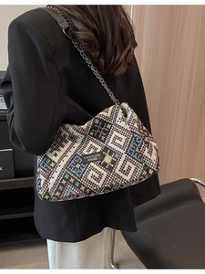 Vintage jacquard chain shoulder bag with geometric patterns shown on a model