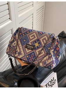 Ethnic knit tote bag with geometric patterns and grey metal chain shoulder strap