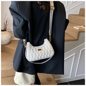Detail of white quilted half-moon bag with adjustable logo strap for shoulder or crossbody