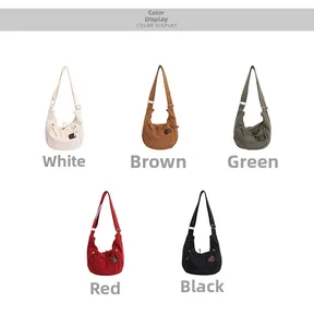 Detailed view of the large canvas crossbody bag displayed in five versatile color options