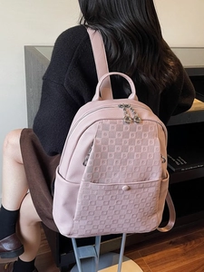 Pink lychee leather backpack for women with checkered embossing and snap front pocket