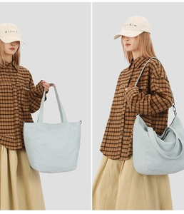 Detailed views of light blue nylon tote bag with adjustable strap and textured surface