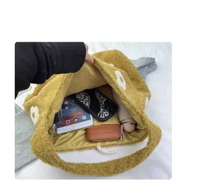 Top view of yellow fleece tote bag interior showing capacity for iPad and phone