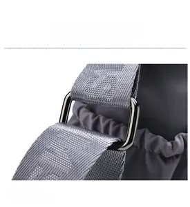 Close-up of durable gray nylon shoulder strap with premium silver metal connector