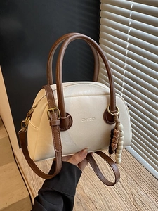 Vintage cream and brown bowling bag with wooden bead charm and adjustable strap