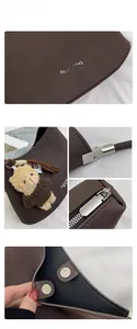 Close-up of litchi grain leather texture with silver hardware and bear charm