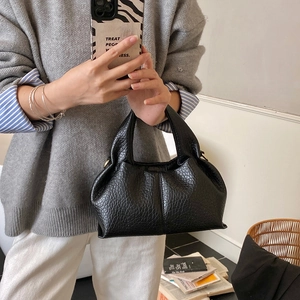 Classic black leather handbag with lychee pattern and retro minimalist design for women