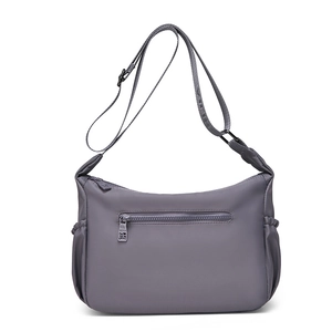 Detailed view of gray-purple waterproof nylon bag with adjustable strap and side pockets