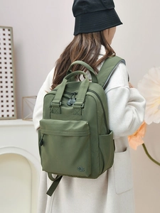 Green lightweight nylon backpack with large capacity and double straps for travel