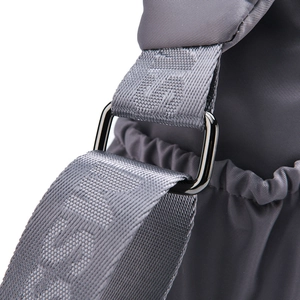 Macro view of nylon strap with woven FASHION text and gunmetal metal adjustment buckle