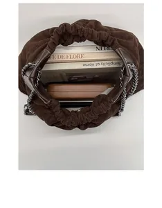 Top view of deep brown pleated cloud bag with silver chain strap and large capacity