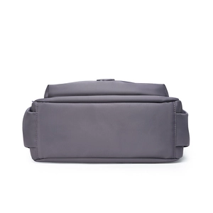 Detailed bottom view of large capacity waterproof nylon crossbody bag with multi-compartments