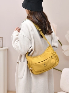 Bright yellow nylon crossbody bag with large capacity and multiple zipper pockets