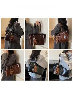Three colors of glossy leather tote bags shown with bear charms on models for commuting
