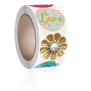 Roll of decorative round stickers featuring floral patterns and gold Love lettering
