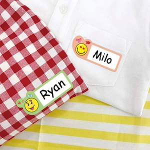 Close-up of waterproof cartoon name stickers for children with Milo and Ryan text