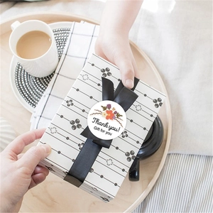 Floral Thank You stickers with botanicals on a white round seal for gift boxes