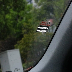 Auto oil change reminder window sticker with service date and mileage fields