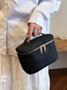 Grande borsa da trucco nera scintillante con cerniere dorate e robusto manico superiore