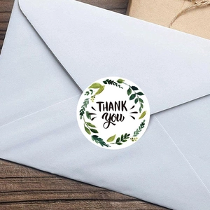 Floral Thank You stickers for gift sealing shown on a light blue envelope seal