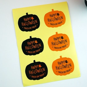 Halloween pumpkin stickers set with Happy Halloween and Trick or Treat text on yellow backing