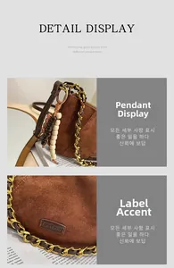 Close-up of brown suede crossbody bag featuring gold chain and beaded wooden charms