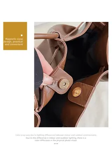 Détail du fermoir magnétique d'un sac seau en cuir marron à motif de grain de litchi