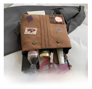Interior view of brown vintage backpack showing capacity for tablet and essentials