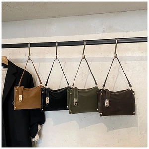 Row of four vintage style rectangular shoulder bags in brown, black, green, and dark coffee
