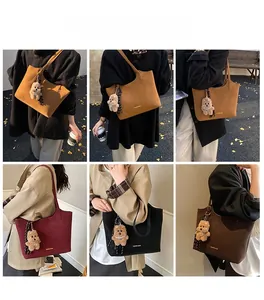 Detailed views of diverse faux leather tote bags with cute bear charms and scarves