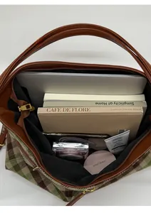 Top view of large vintage plaid tote bag showing spacious interior with laptop and books