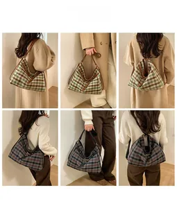 Detail view of large retro plaid tote bag showing shoulder, crossbody and handheld options