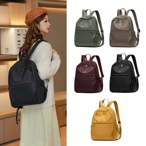Detailed view of lightweight nylon backpack in five colors with water-resistant fabric