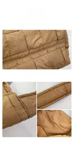 Detail of brown quilted bubble fabric textures and inner pocket of the shoulder bag