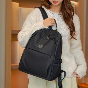 Lifestyle shot of black oxford fabric backpack showing comfortable adjustable straps