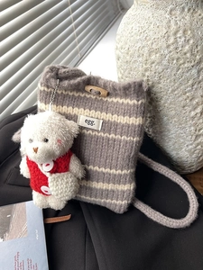 Chic grey striped knit bucket bag with wooden toggle and cute plush bear charm