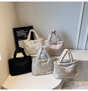 Detailed display of vintage Chinese embroidered puffy bags in five elegant silk colors