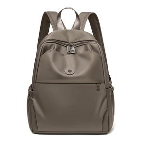 Front view of khaki waterproof oxford nylon backpack showing sleek texture and metal M-zippers