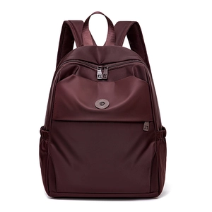 Detailed front view of the water-resistant burgundy oxford backpack with double zippers