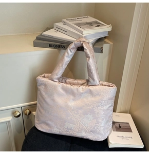 Detail of soft padded cotton tote with elegant traditional Chinese landscape jacquard