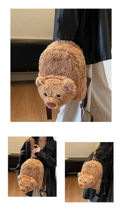 Detailed close-up showing texture and adjustable straps of a brown plush bear backpack