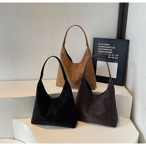 Detailed display of three matte suede hobo bags in black, brown, and dark coffee colors