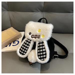 Detail of plush backpack showing furry bunny ears, checkered pattern and Happy Days tag