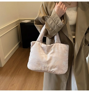 Detail of light pink embroidered tote bag with traditional Chinese pavilion jacquard texture