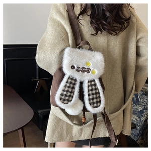 Detail view of cute plush bunny backpack with plaid ears and Happy Days logo on the back