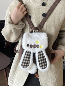 Mini plush backpack with white faux fur rabbit ears and brown plaid lining