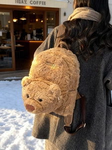 Cute brown plush teddy bear backpack with 3D ears and soft fluffy texture for winter